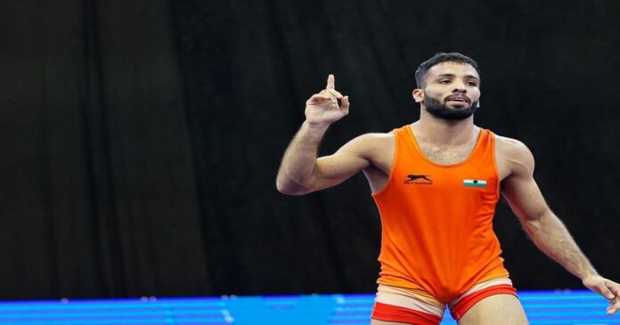 एशियन गेम्स 2026 में 65 किलो फ्रीस्टाइल कुश्ती का गोल्ड जीतने के बाद सुजीत कलकल।